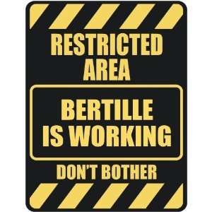   RESTRICTED AREA BERTILLE IS WORKING  PARKING SIGN