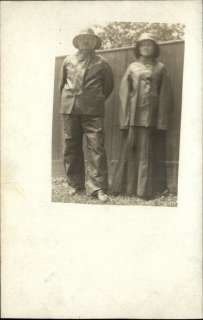 Man & Woman in Rain Gear Raincoat c1910 Real Photo Postcard  