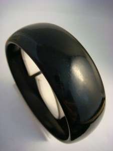 This auction features Big Wide Heavy Blacky Bakelite Bangle Bracelet 