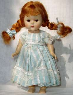 This is an adorable strung Vogue Ginny doll.