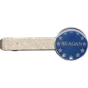Tie clasp promoting Ronald Reagan for president, 1980. Brass and epoxy 