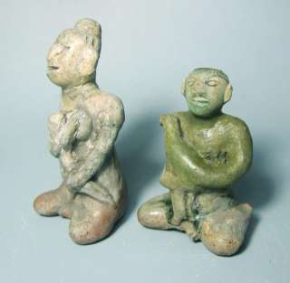  the left hand of both figurines and the right hand of infant restored