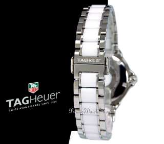 Watch comes with Tag Heuer box, case, and instruction booklet.
